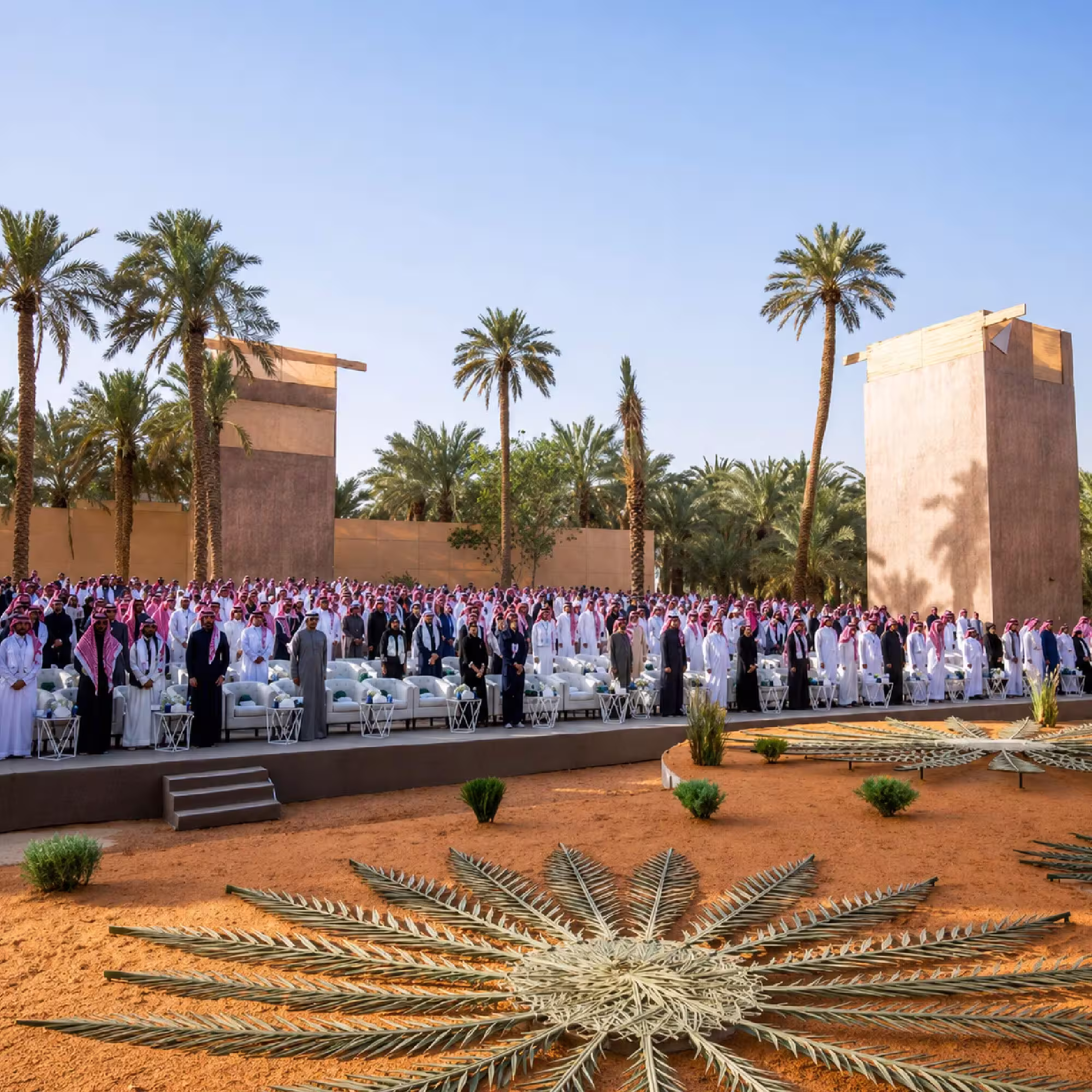 Large outdoor event setup with guest seating and event structures in Dubai