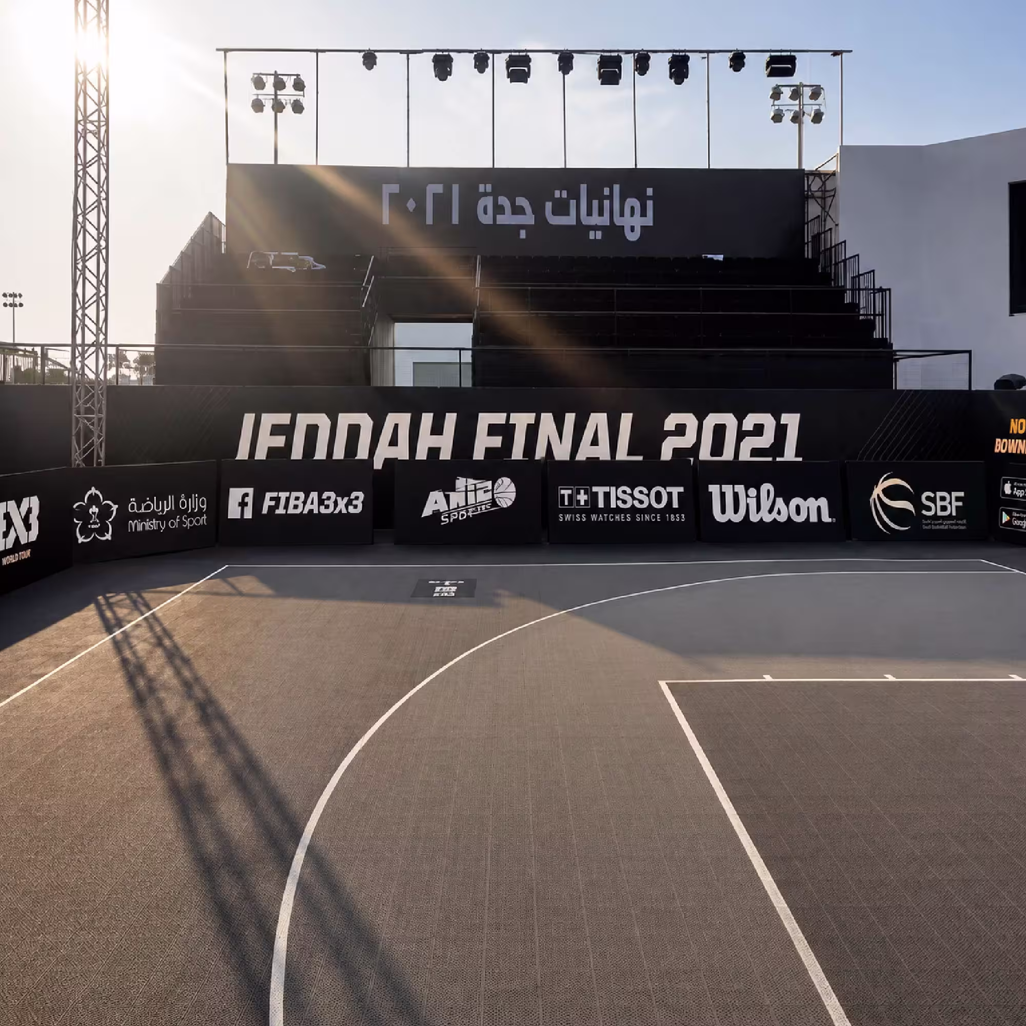 Outdoor sports event stage with lighting rig and elevated spectator platform in Jeddah